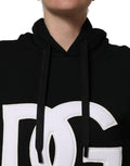 Sweat à capuche Dolce & Gabbana noir et blanc avec appliqués, style décontracté, en coton, visible sur le mannequin.