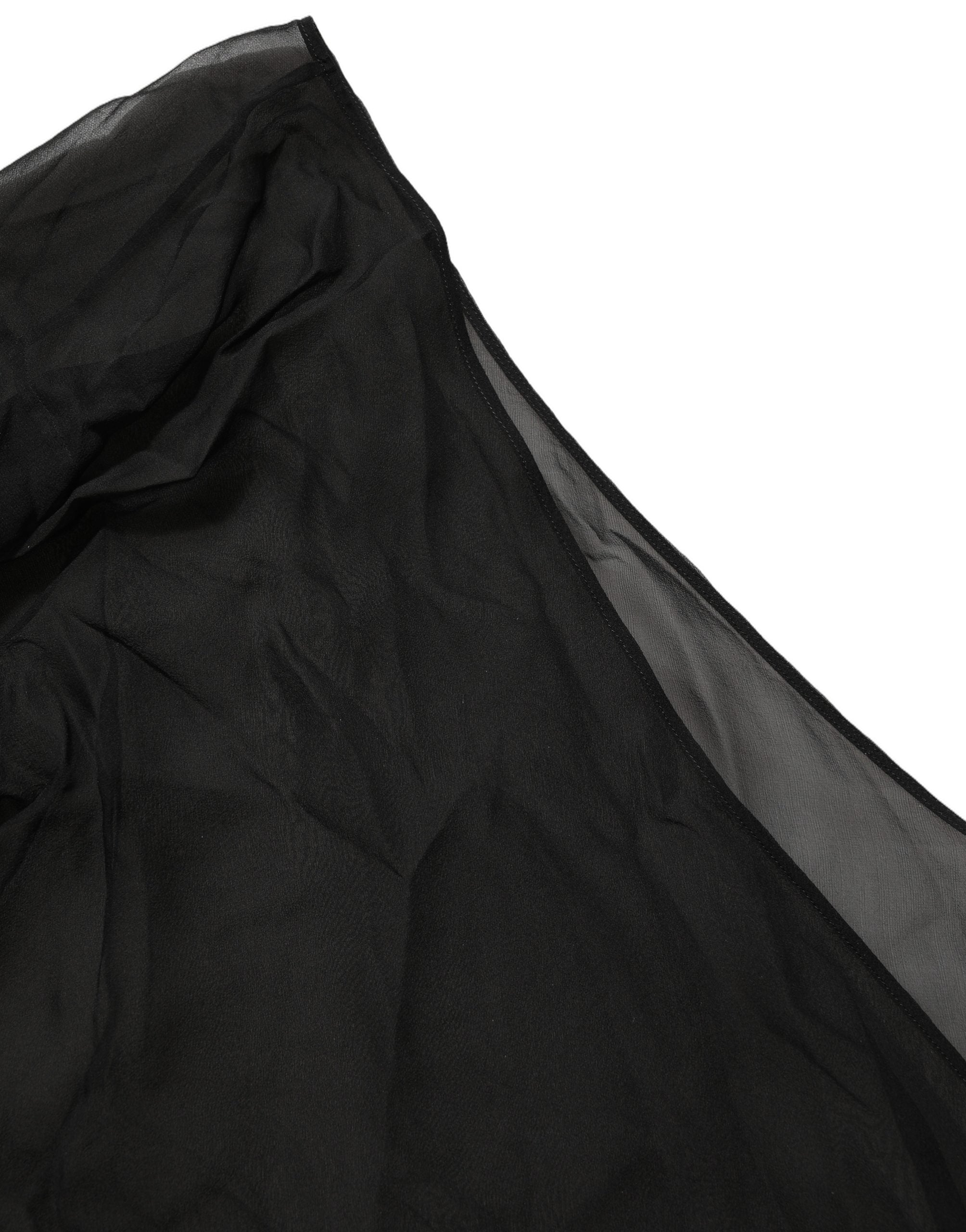 Top noir en chiffon transparent Dolce & Gabbana à épaules asymétriques et coupe enveloppante, élégant et féminin.