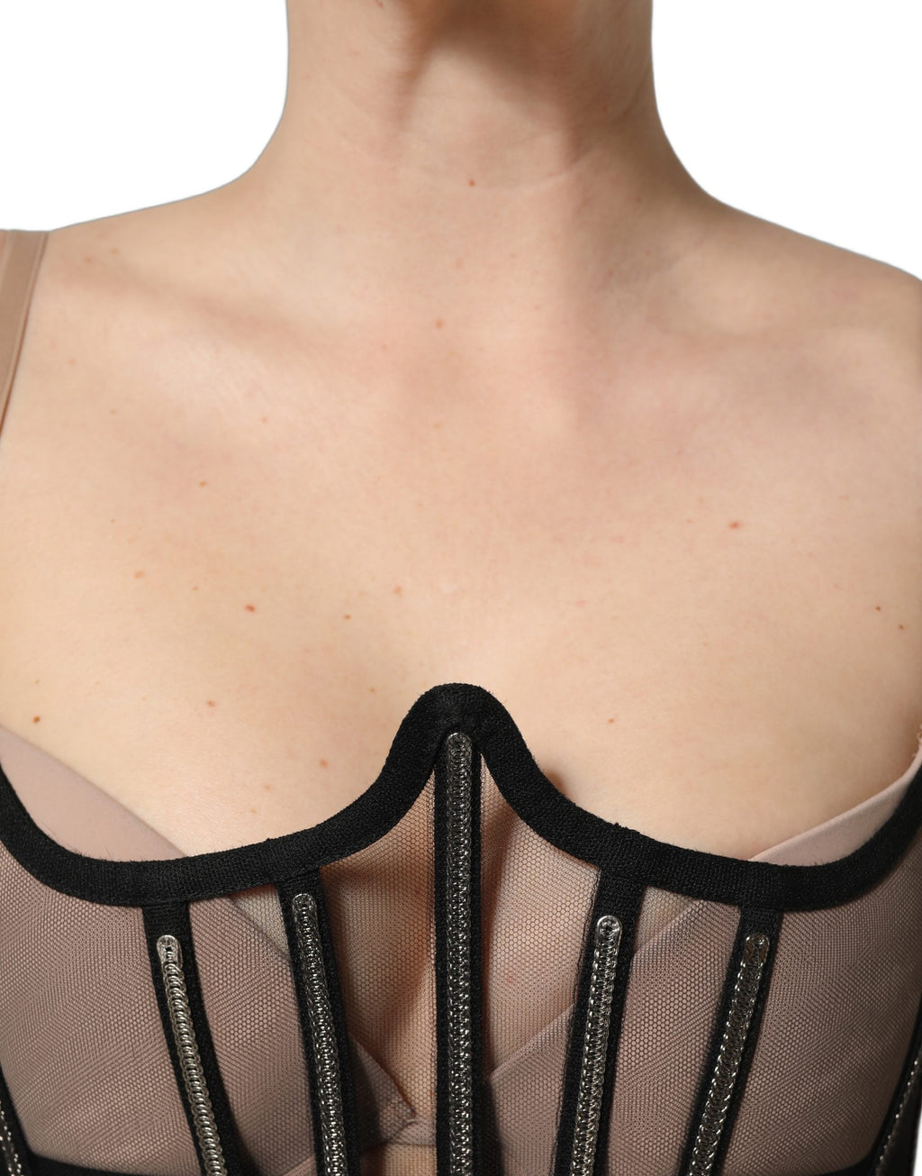 Corset cropé en tulle noir de Dolce & Gabbana, body transparent avec détails élégants et finition délicate.