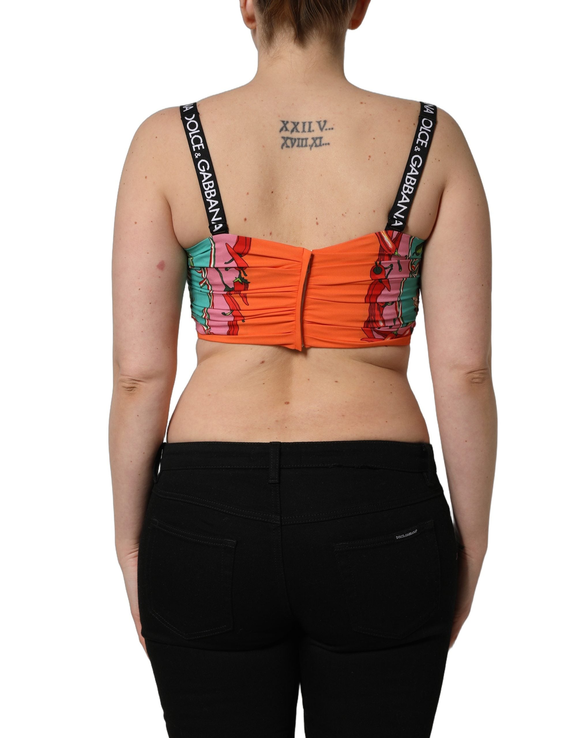 Top court Dolce & Gabbana en soie turquoise avec imprimé végétal, coupe crop, pour un style élégant et tendance.