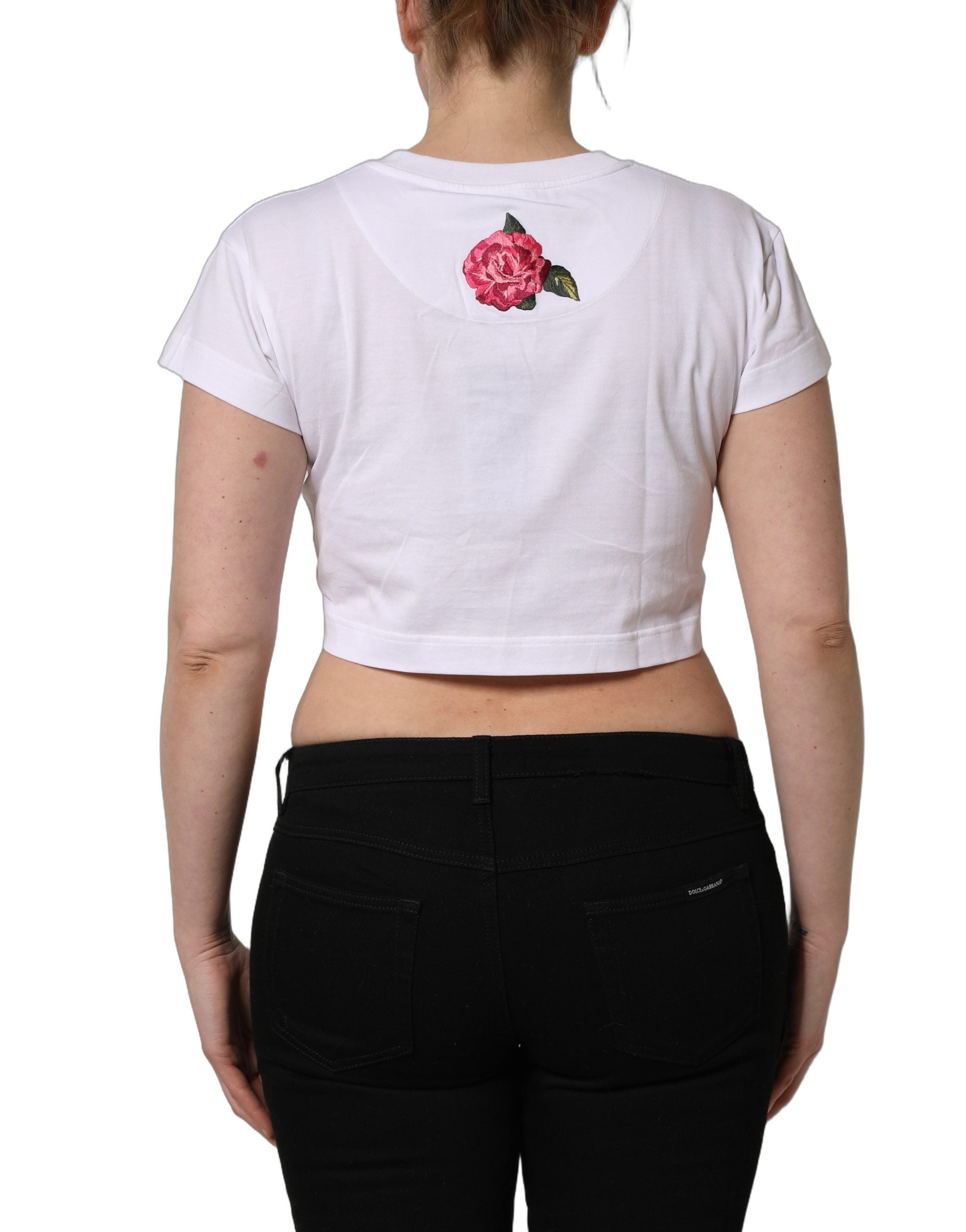T-shirt crop en jersey de coton blanc Dolce & Gabbana avec motif floral DG, visible avec col rond et coupe ajustée.