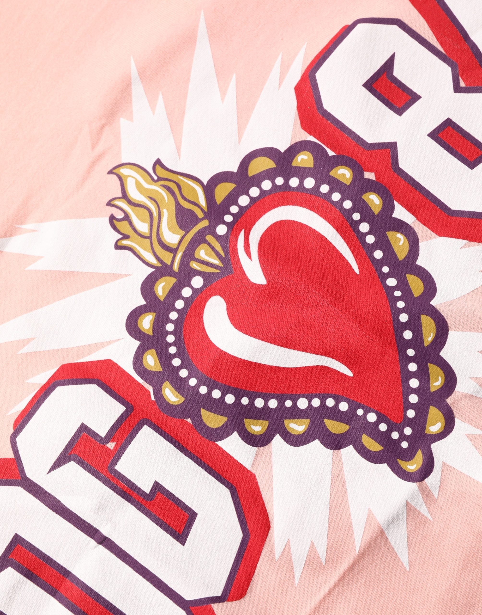 T-shirt blanc en coton Dolce & Gabbana avec imprimé graphique rose et col rond, style décontracté et mode.
