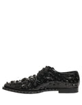 Chaussures derby en cuir noir Dolce & Gabbana pour homme, élégantes, avec clous décoratifs et finition formelle.