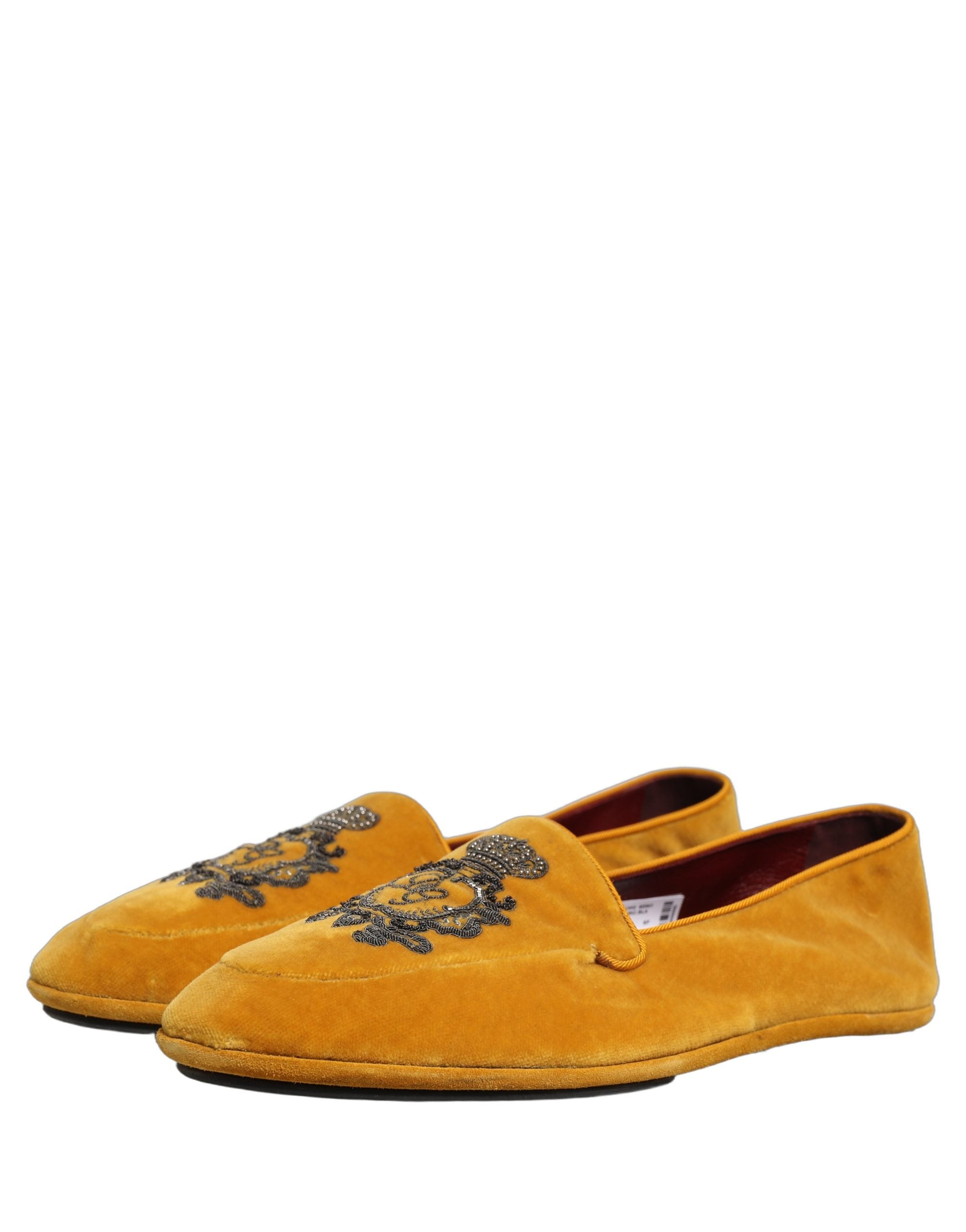Chaussures loafers Dolce & Gabbana en velours jaune avec broderie de couronne, style élégant et luxueux.