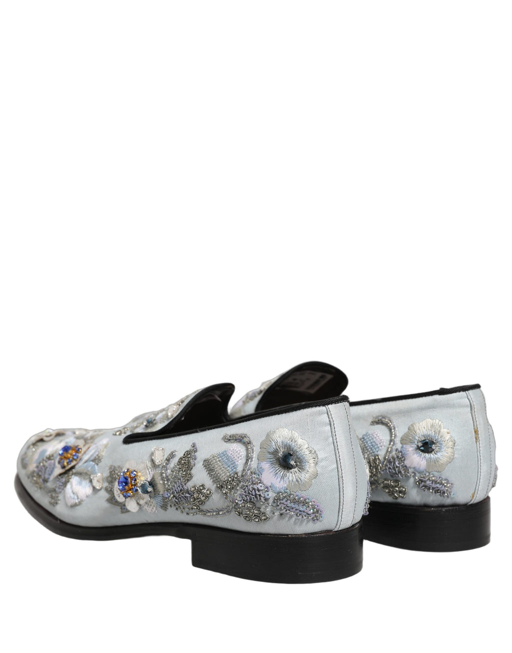 Chaussures mocassins pour hommes Dolce & Gabbana blanches avec broderies florales et embellissements élégants.