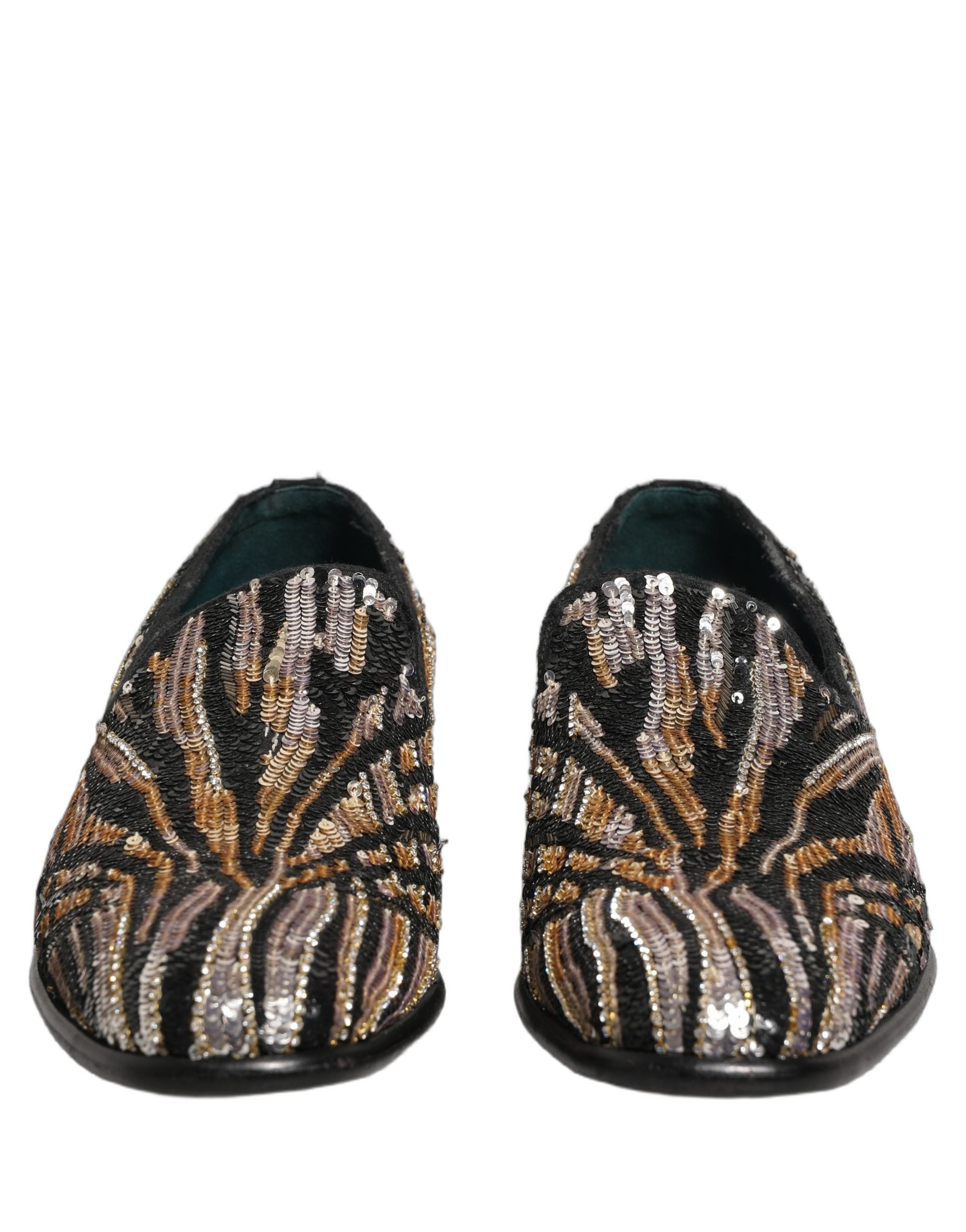 Chaussures loafers Dolce & Gabbana en sequins or à rayures, embellies de détails brillants et élégants.