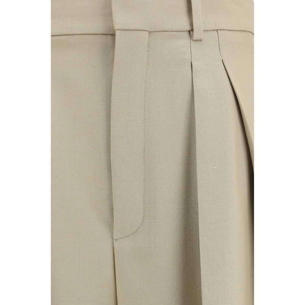 Pantalon beige en laine de Saint Laurent, style élégant et classique, vue de face avec détails de couture.