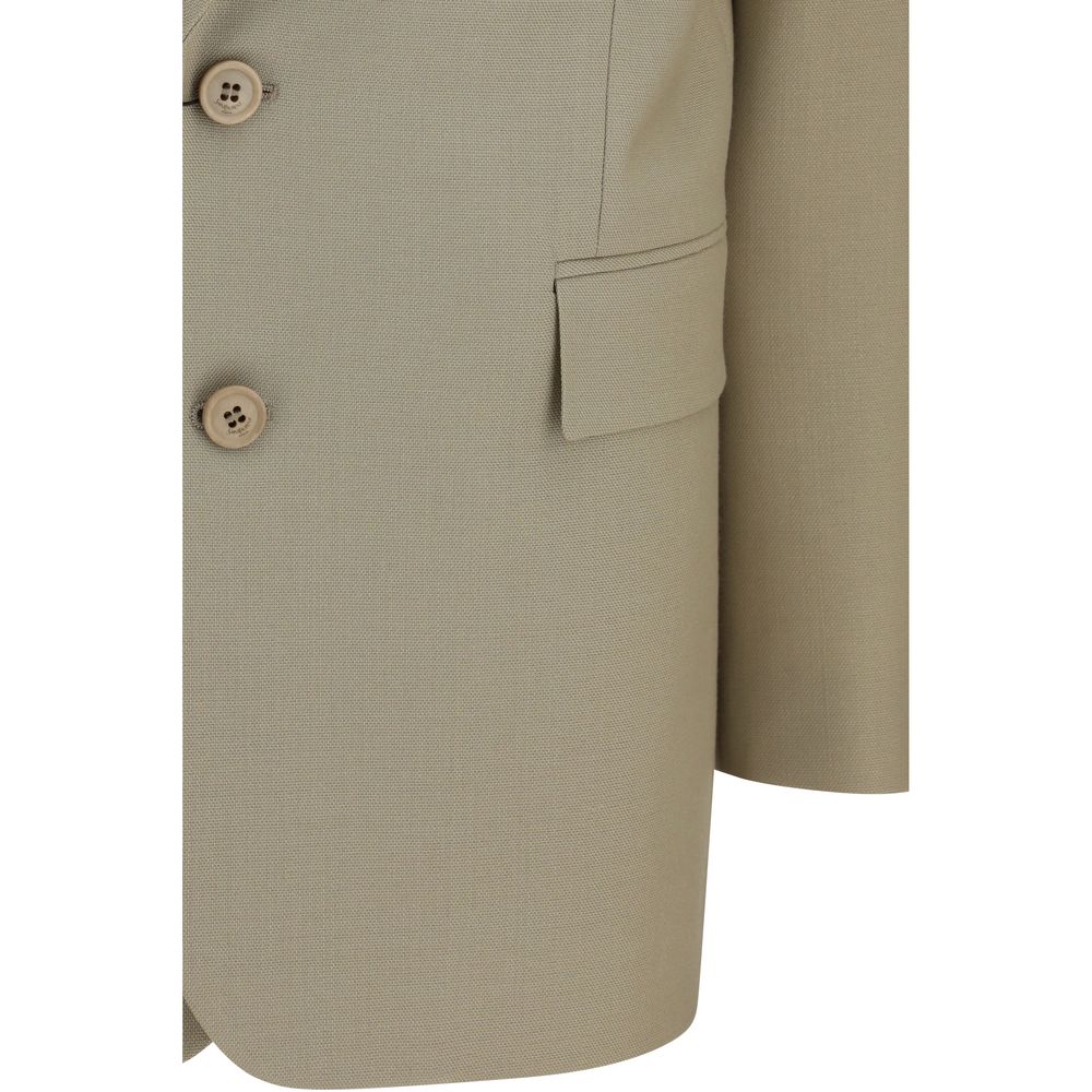 Blazer en laine beige Saint Laurent Oves Aries, coupe élégante, détail de couture, porté sur un mannequin.