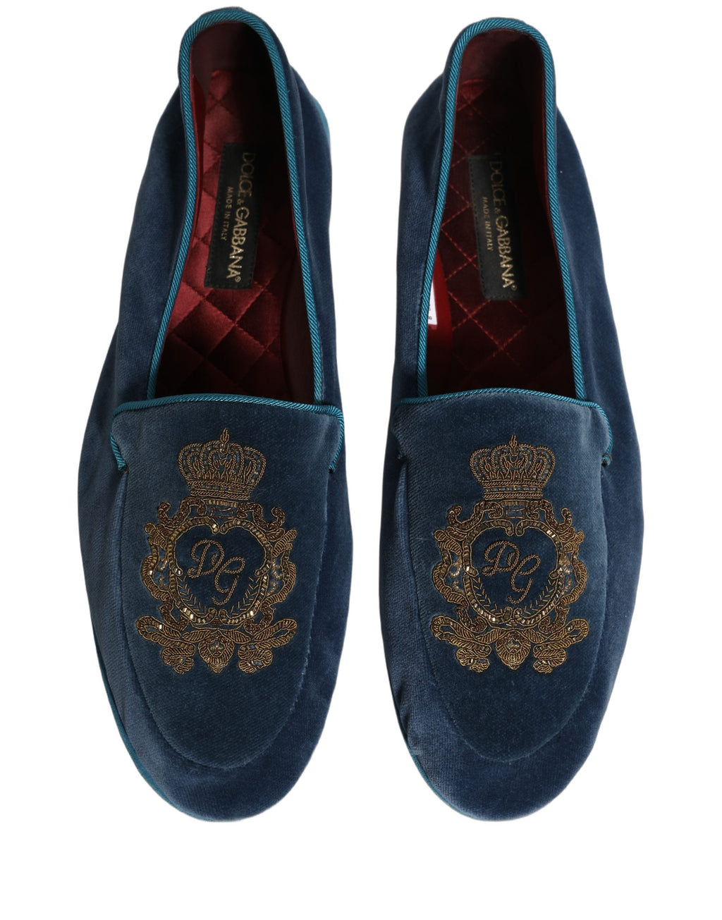 Chaussures loafers Dolce & Gabbana en velours bleu avec broderie couronne, élégantes et sophistiquées, vue de face.