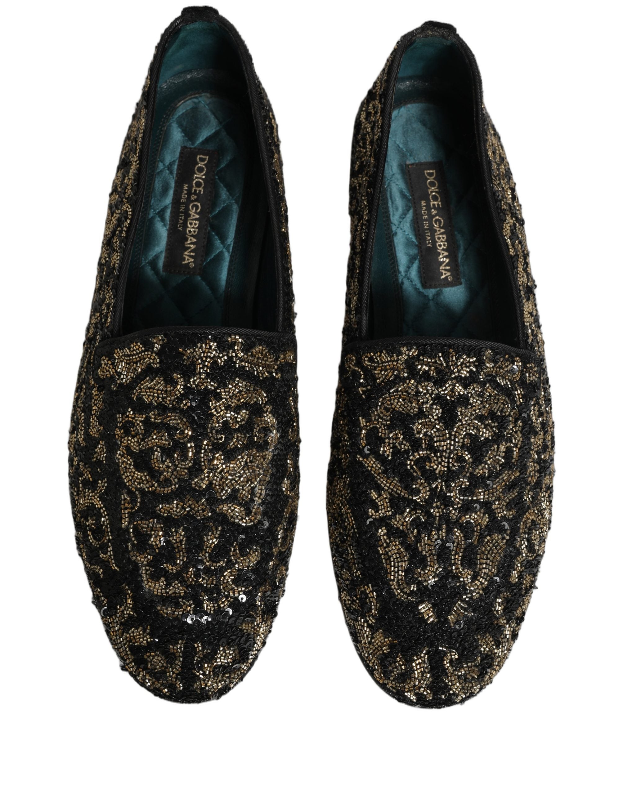 Chaussures loafers Dolce & Gabbana noires et or ornées de détails brillants, élégantes et sophistiquées.