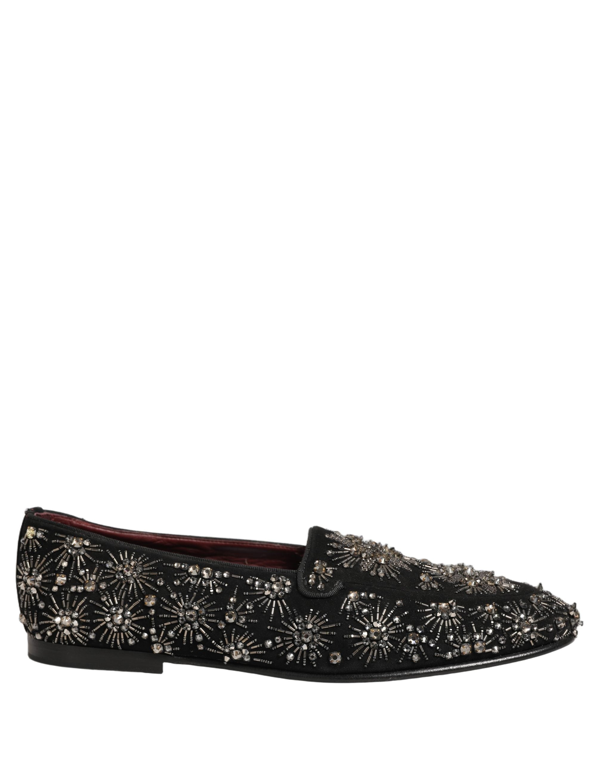 Chaussures loafers Dolce & Gabbana noires avec cristaux ornementaux, élégantes et sophistiquées, vues de côté.