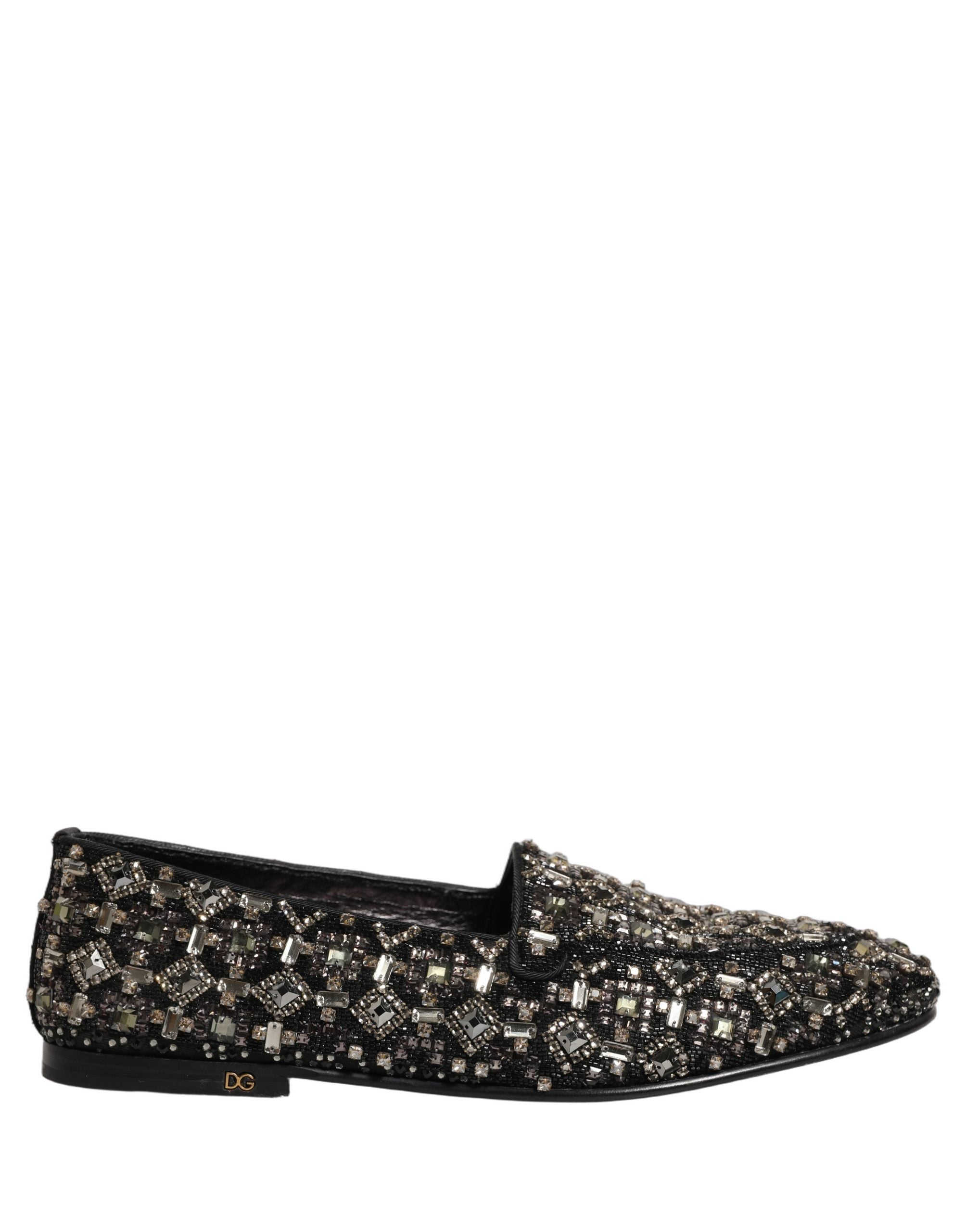 Chaussures loafers en cuir argenté Dolce & Gabbana avec logo, style slip-on, élégantes et modernes pour femmes.