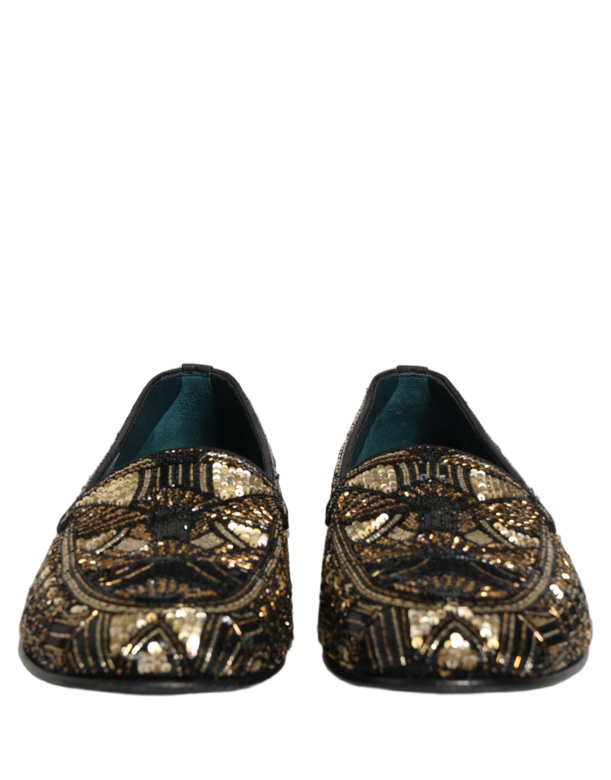 Chaussures mocassins Dolce & Gabbana noires et or avec embellissements, style slip-on élégants et sophistiqués.