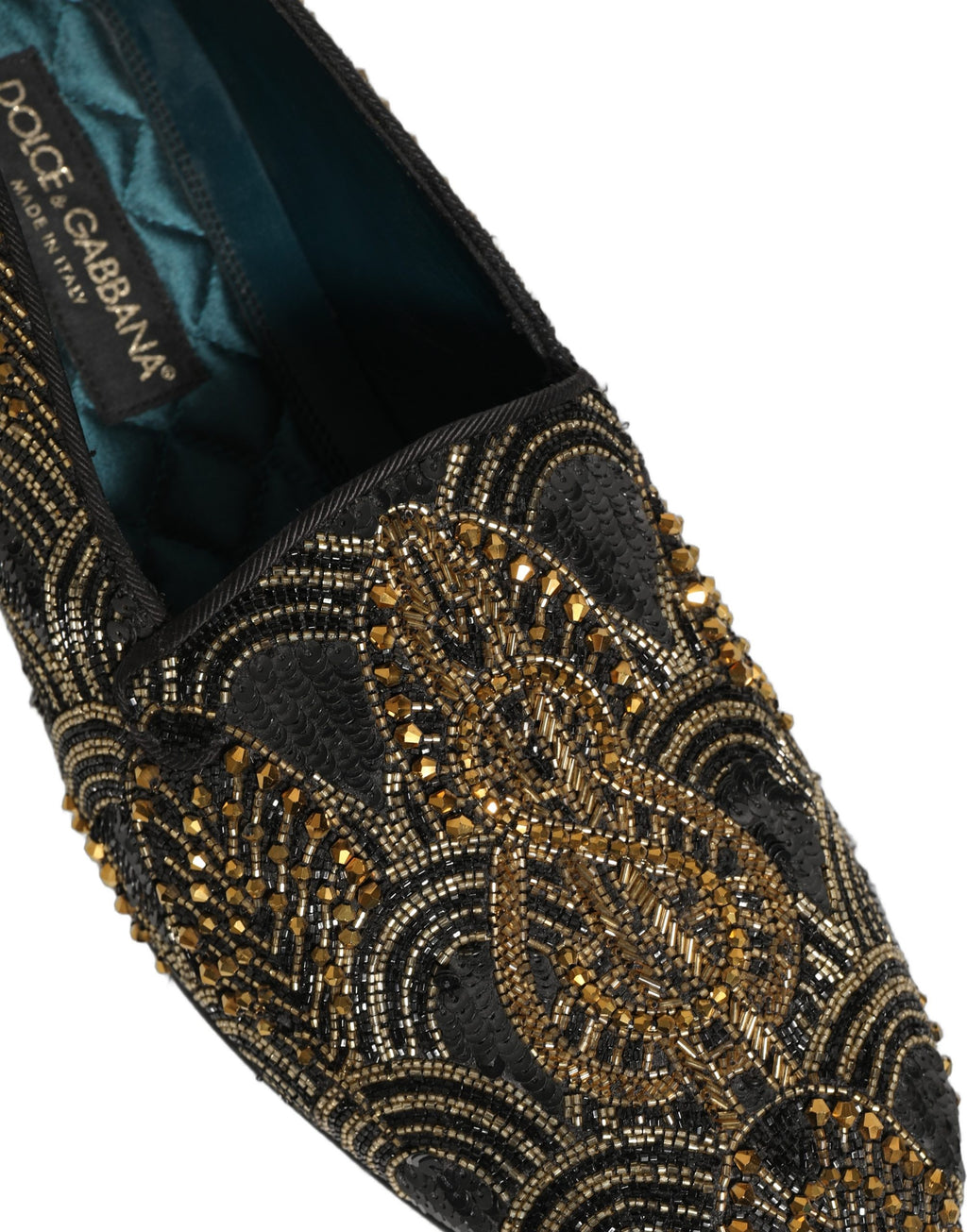 Chaussures mocassins Dolce & Gabbana noires et dorées avec embellissements élégants, pour un style sophistiqué et luxueux.