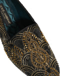 Chaussures mocassins Dolce & Gabbana noires et dorées avec embellissements élégants, pour un style sophistiqué et luxueux.