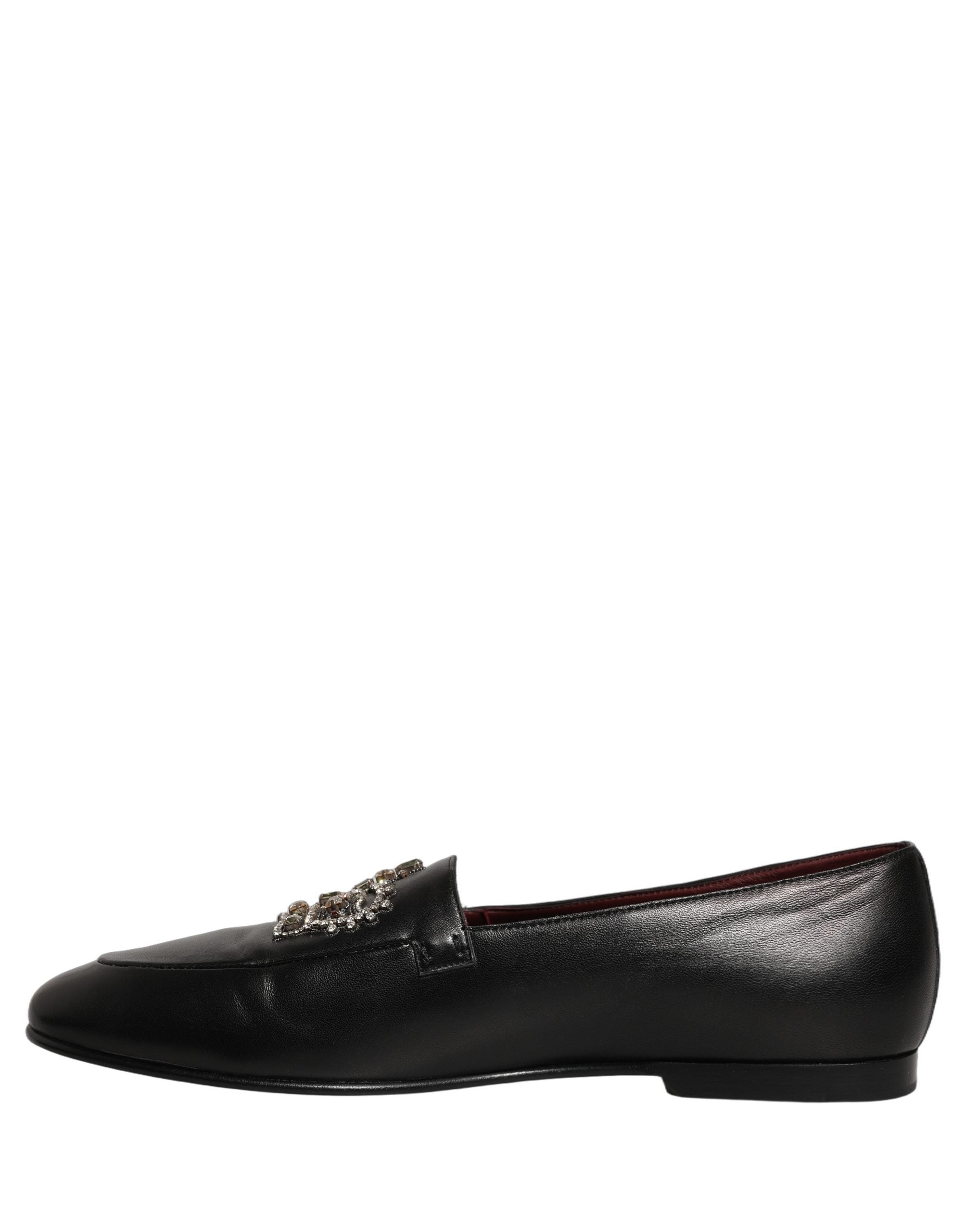 Mocassins en cuir noir Dolce & Gabbana avec couronne ornée de bijoux, élégants et sophistiqués pour homme.