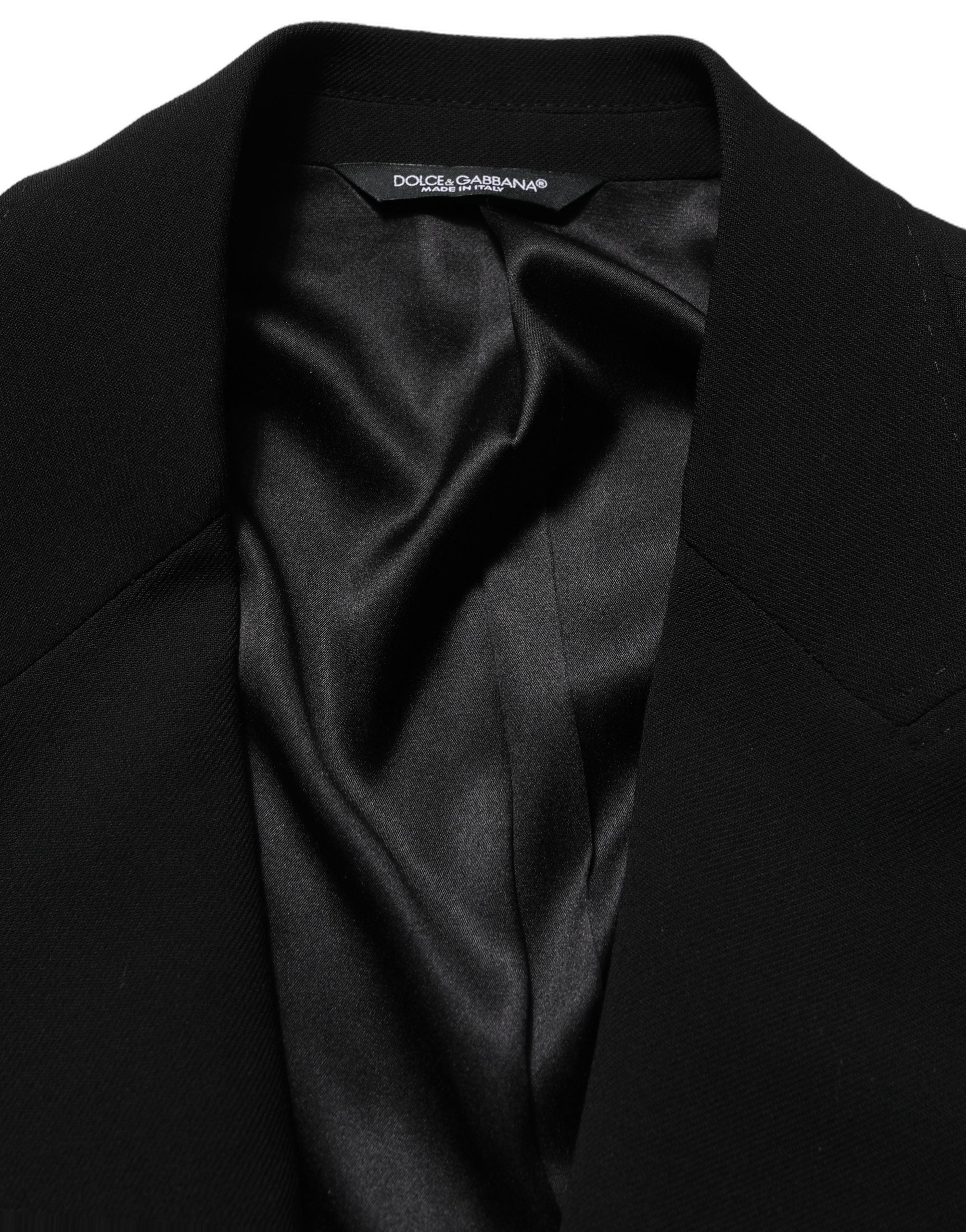 Blazer homme Dolce & Gabbana en laine noire, à boutonnière simple, style élégant et classique, porté sur un mannequin.