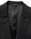 Blazer pour homme en laine noire Dolce & Gabbana, à simple boutonnage, style élégant et sophistiqué.