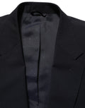 Blazer homme en laine noire Dolce & Gabbana à boutonnière simple, élégante veste ajustée pour hommes.