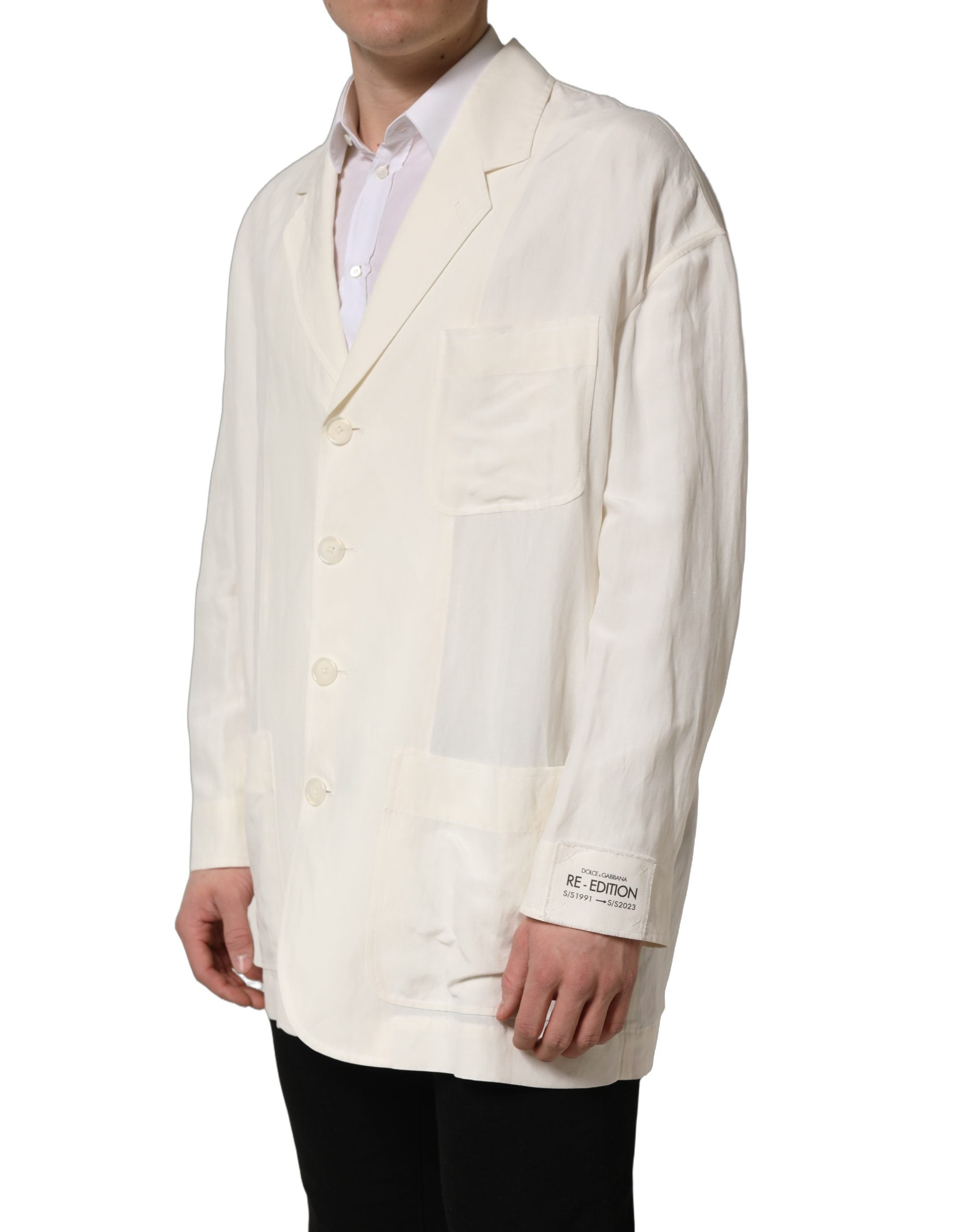 Blazer homme Dolce & Gabbana en lin blanc cassé, coupe simple et boutonnée, style élégant et moderne.