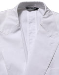 Veste blazer blanche en coton Dolce & Gabbana à double boutonnage, élégante et structurée, vue de face sur fond neutre.