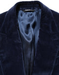Veste blazer en velours bleu Dolce & Gabbana à boutonnage simple, élégante et sophistiquée, vue de face.