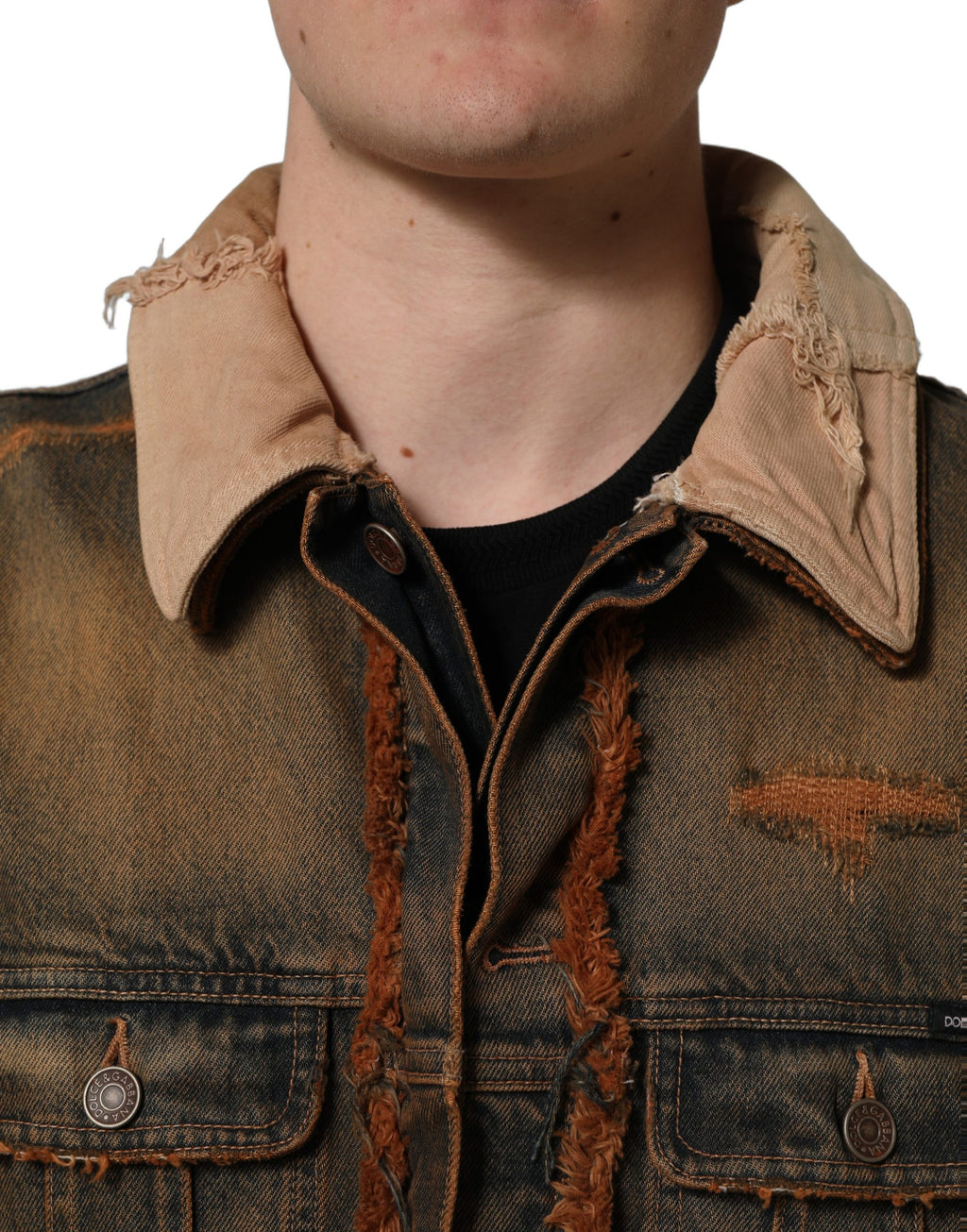 Veste homme en denim multicolore à panneaux brut de coupe de Dolce & Gabbana, détails de couture visibles.