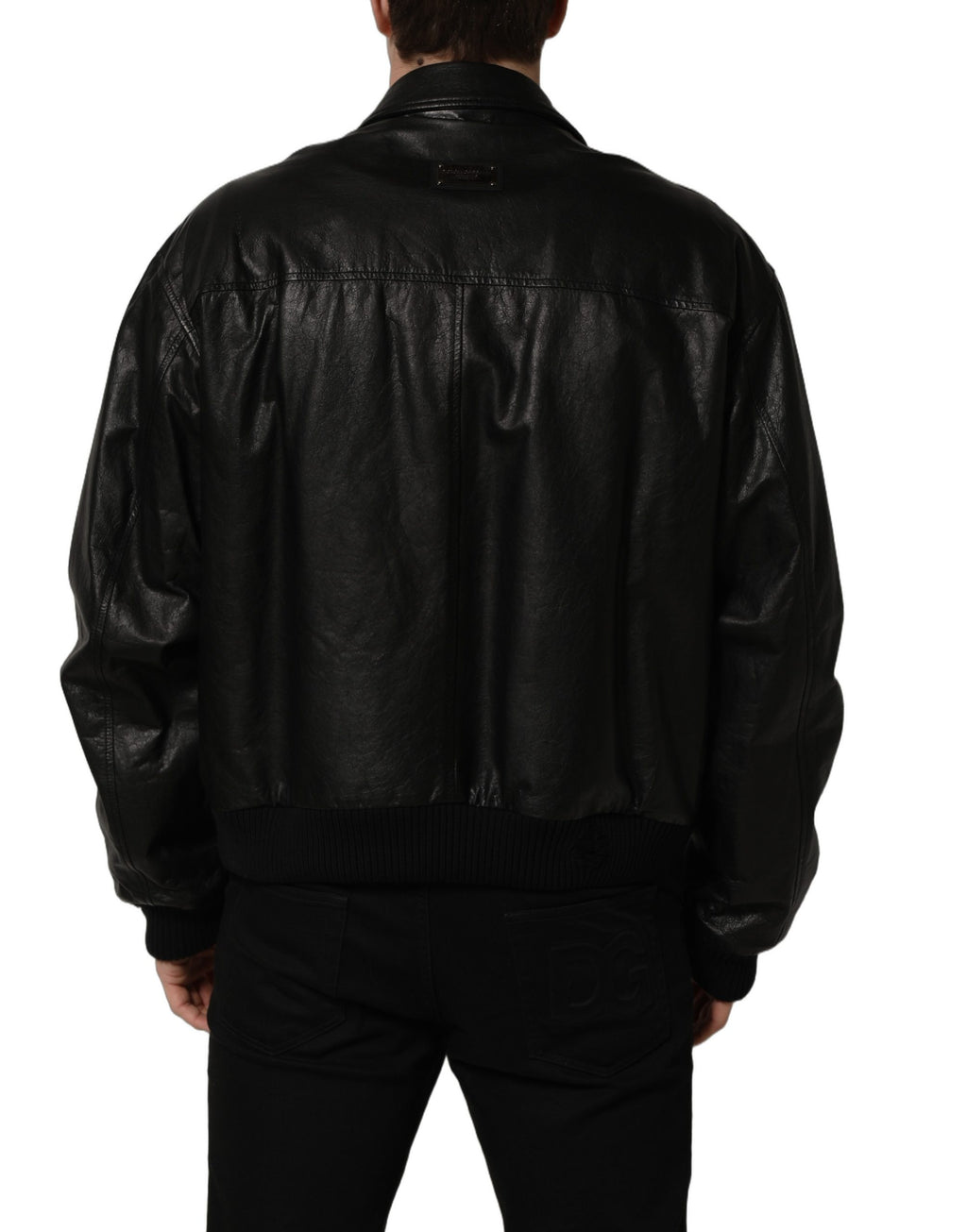 Veste noire en cuir pour homme de style motard Dolce & Gabbana avec fermeture éclair complète, coupe élégante et détails en cuir.