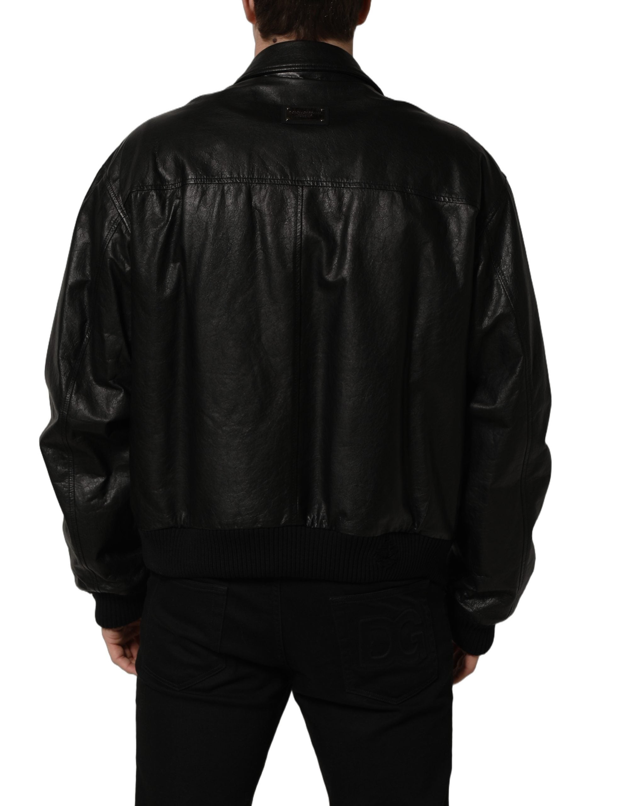 Veste noire en cuir pour homme de style motard Dolce & Gabbana avec fermeture éclair complète, coupe élégante et détails en cuir.