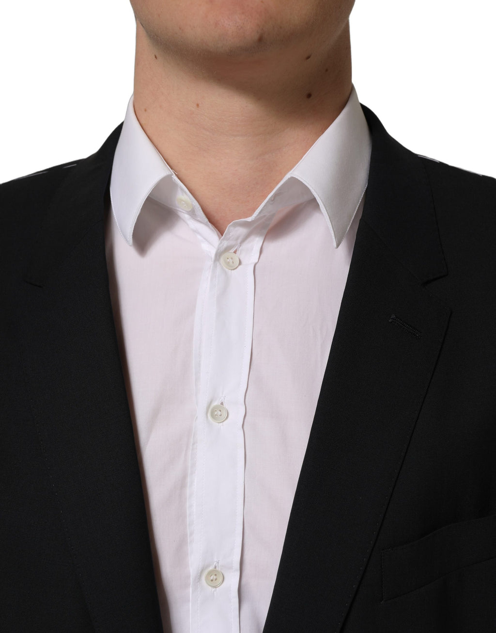 Blazer en laine noire Dolce & Gabbana, veste à un bouton et coupe classique, visible en gros plan sur l'image.