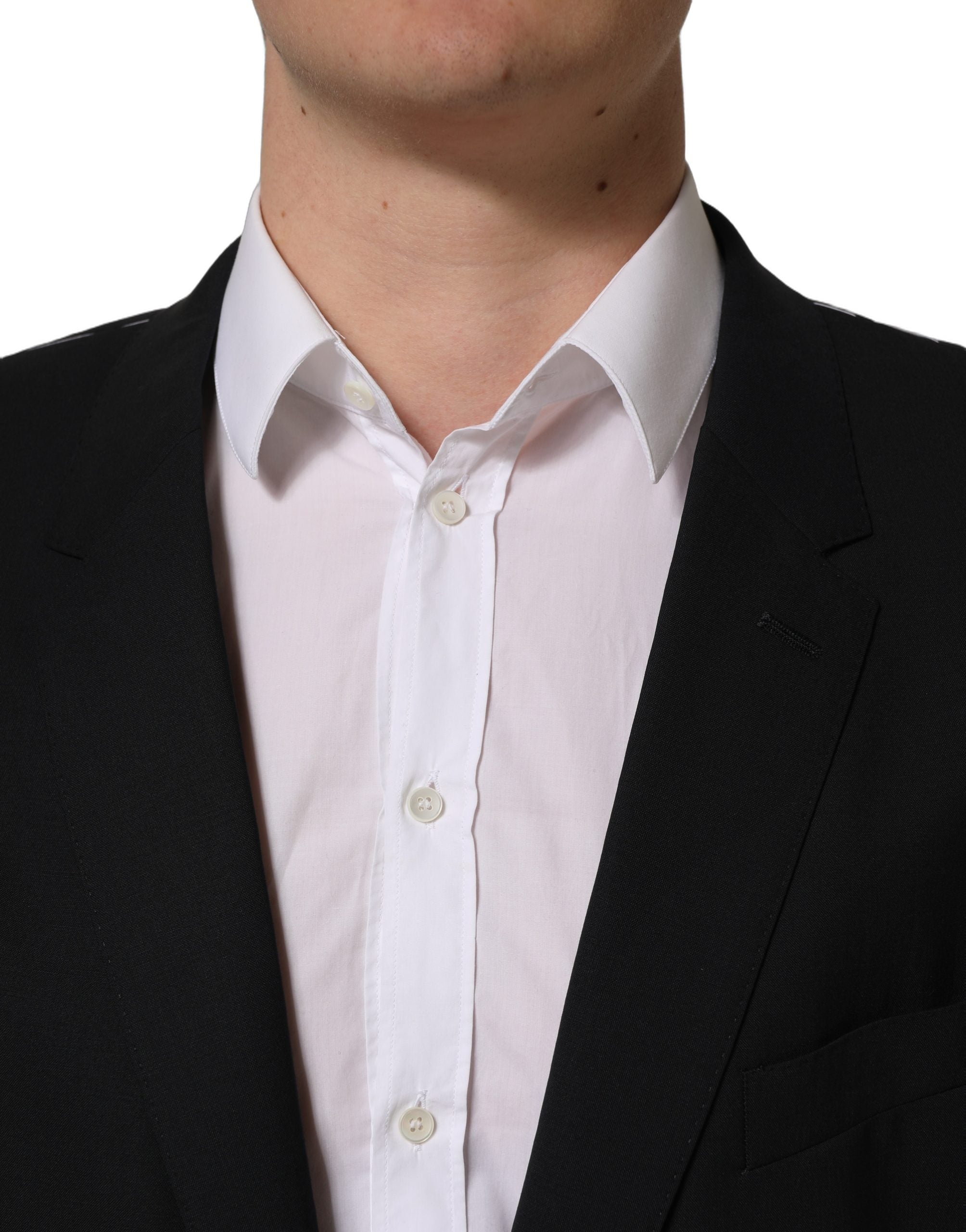 Blazer en laine noire Dolce & Gabbana, veste à un bouton et coupe classique, visible en gros plan sur l'image.