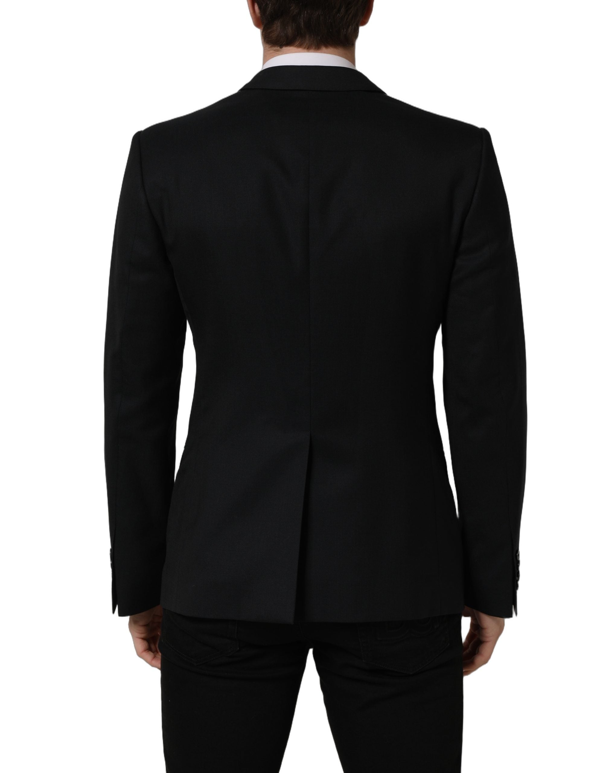 Veste blazer en laine noire Dolce & Gabbana à boutonnière simple, élégante et structurée, portée sur fond blanc.