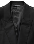 Veste blazer en laine noire Dolce & Gabbana à un seul bouton, coupe élégante et classique pour homme.