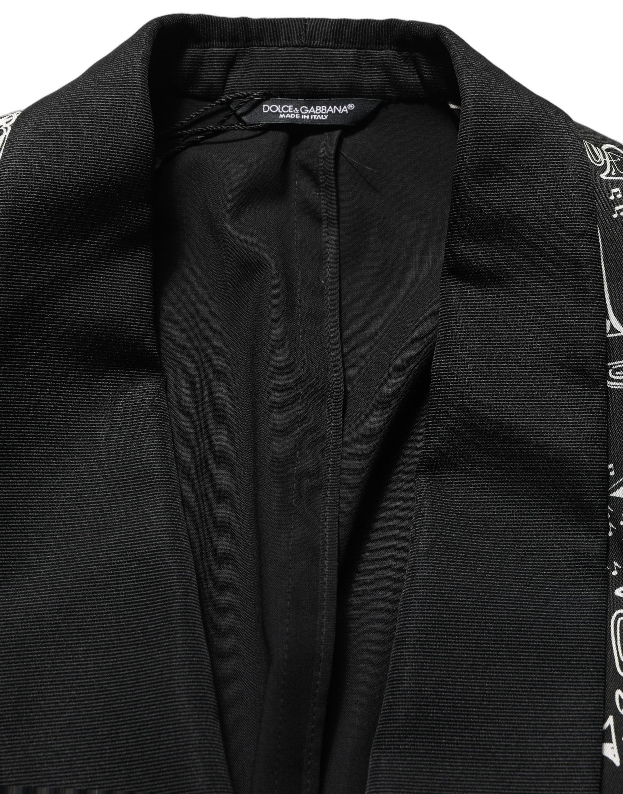 Blazer noir Dolce & Gabbana avec embellissements en cristal, veste élégante en tissu sophistiqué, détails raffinés et couture haut de gamme.