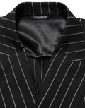 Veste en laine à rayures noires Dolce & Gabbana, à double boutonnage, élégante et sophistiquée.