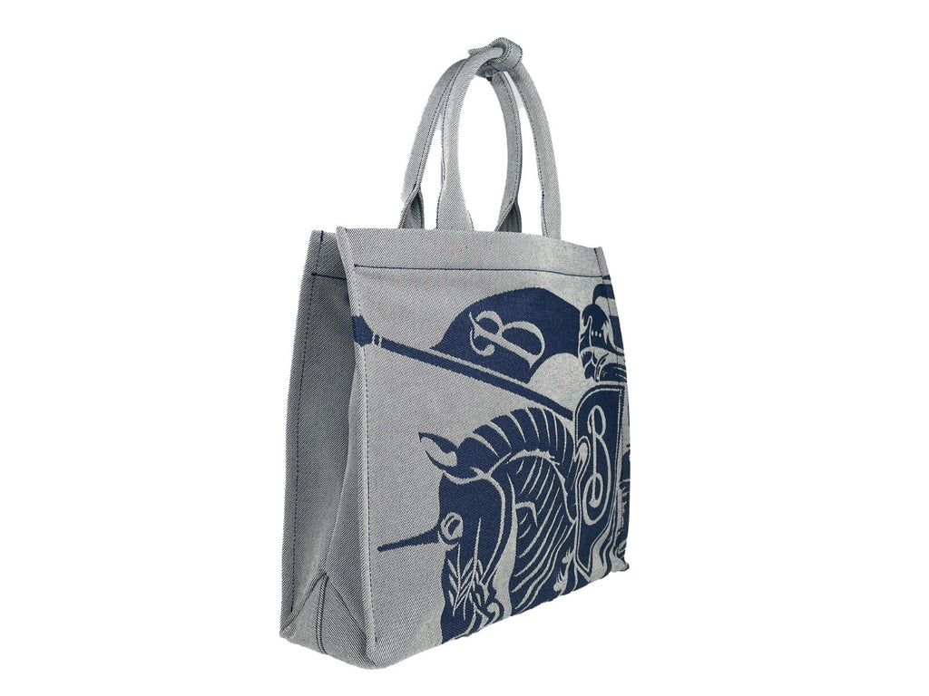 Sac cabas en toile navy de Burberry avec poche à monnaie, design élégant et pratique, visible avec détails du logo et de la toile.