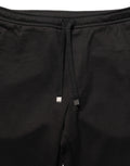 Pantalon jogging en laine noire Dolce & Gabbana pour homme, pantalon de sport élégant avec cordon de serrage et poches.