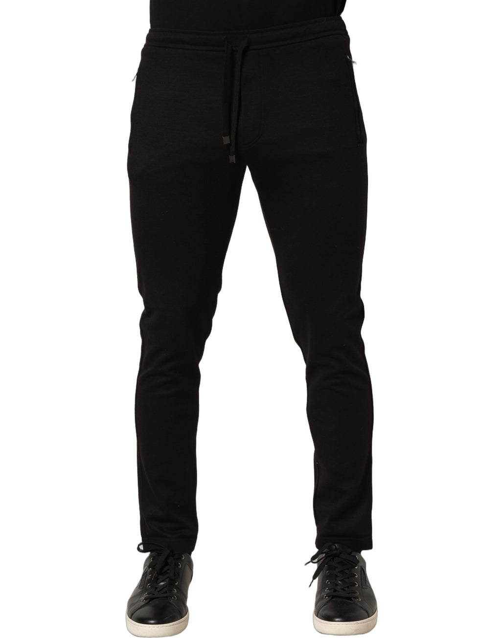 Pantalon jogging en laine noire pour homme de Dolce & Gabbana, sweatpants décontractés avec ceinture élastique et poche latérale.