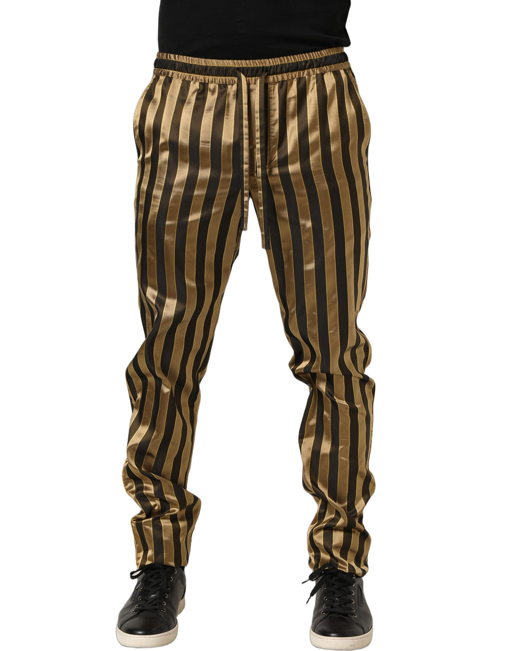 Pantalon homme Dolce & Gabbana en satin noir et or à rayures, coupe tapered, élégance et style sophistiqué.