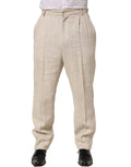Pantalon homme en lin beige Dolce & Gabbana, coupe tapered, pantalon de costume élégant avec ceinture et plis frontaux.