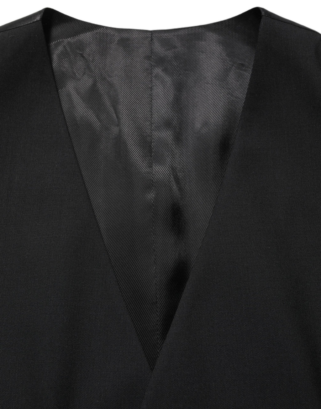 Gilet en laine noir Dolce & Gabbana à col montant et fermeture à boutons simples, porté de face sur fond blanc.