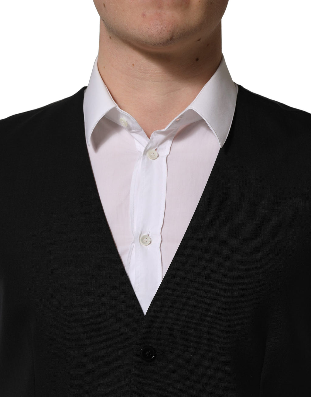 Gilet en laine noir Dolce & Gabbana avec fermeture simple et col en V, image montrant le détail du tissu et de la coupe.