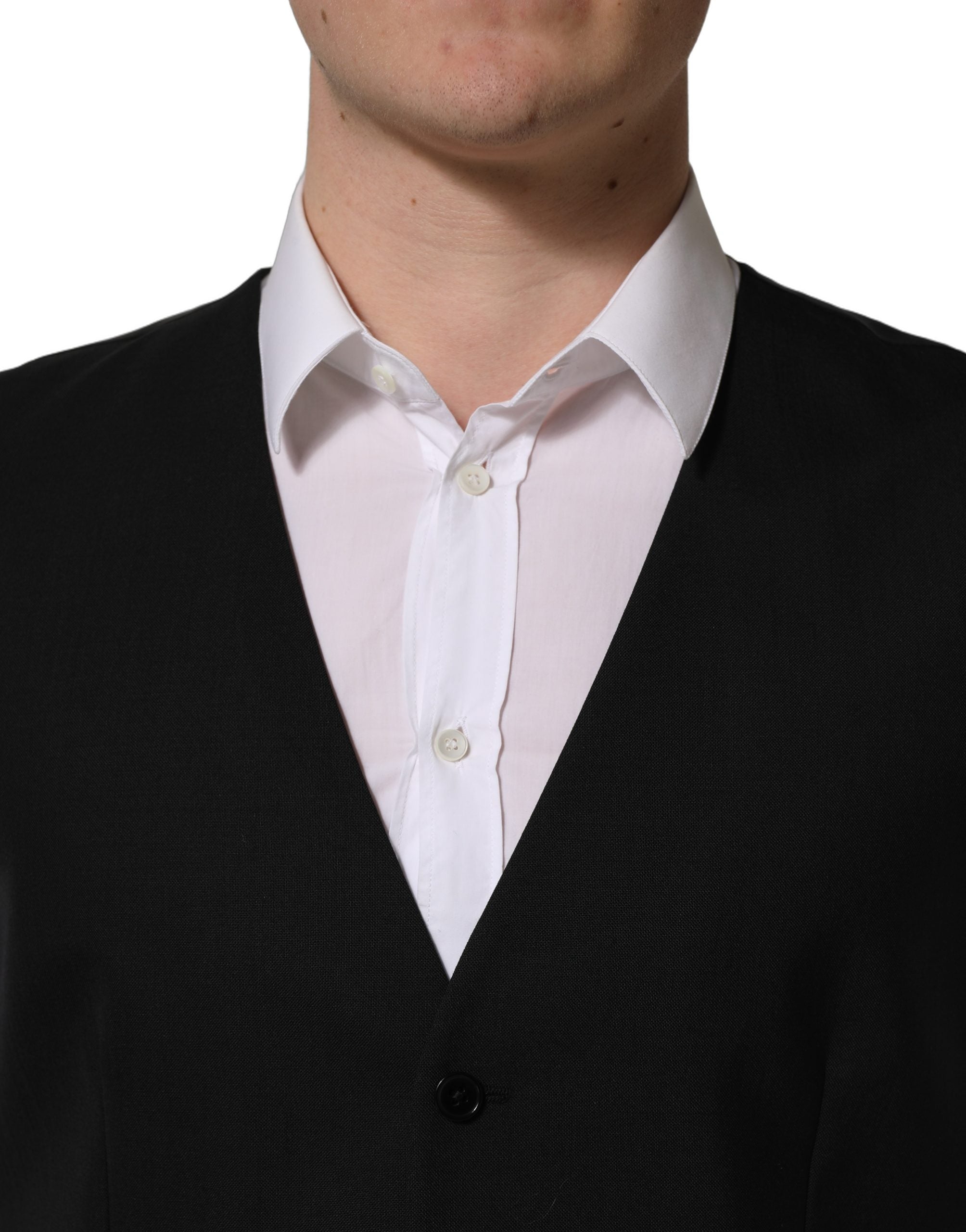 Gilet en laine noir Dolce & Gabbana avec fermeture simple et col en V, image montrant le détail du tissu et de la coupe.
