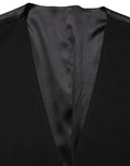 Gilet en laine noire Dolce & Gabbana à boutonnière simple, veste cintrée élégante pour homme.