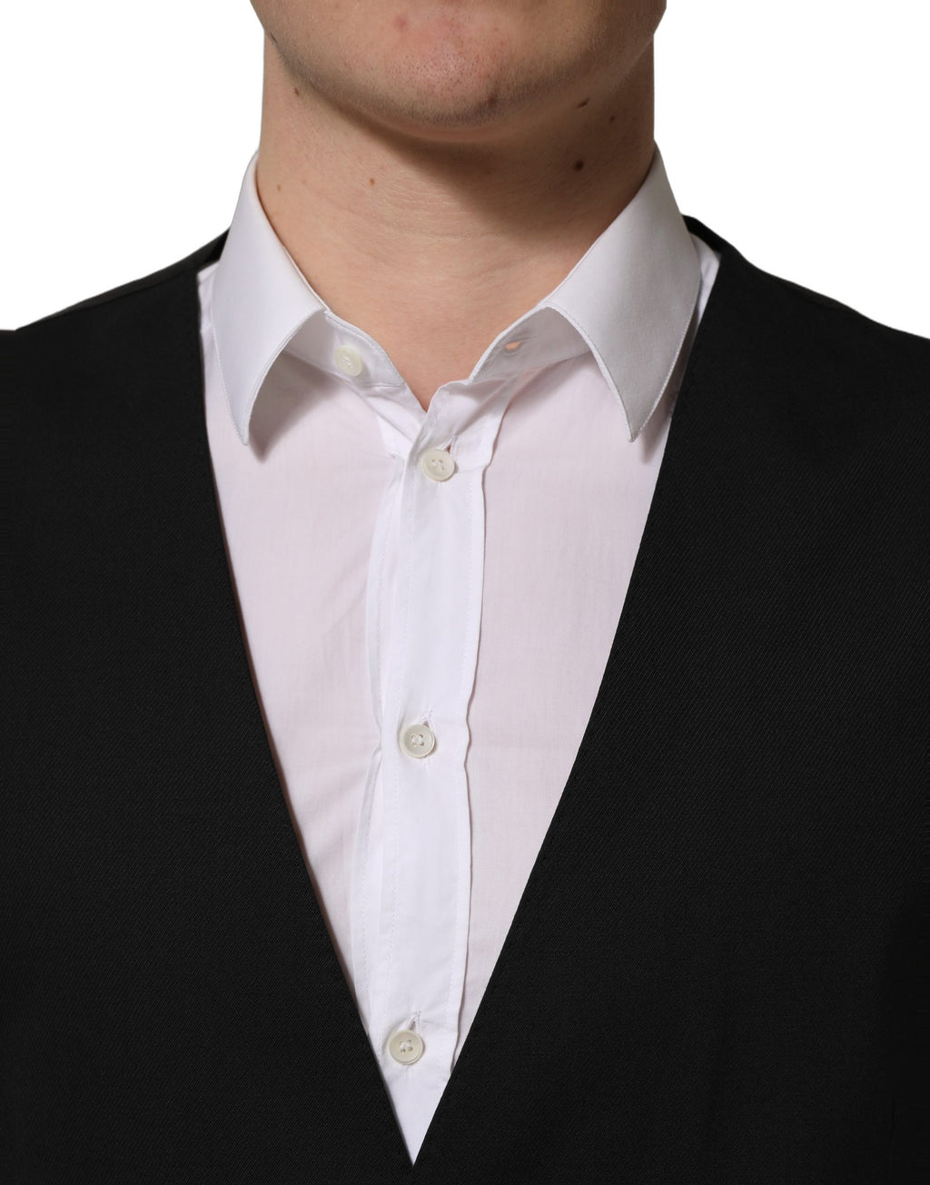Gilet pour homme Dolce & Gabbana noir à boutons simple, élégant et ajusté, porté sur un costume formel.