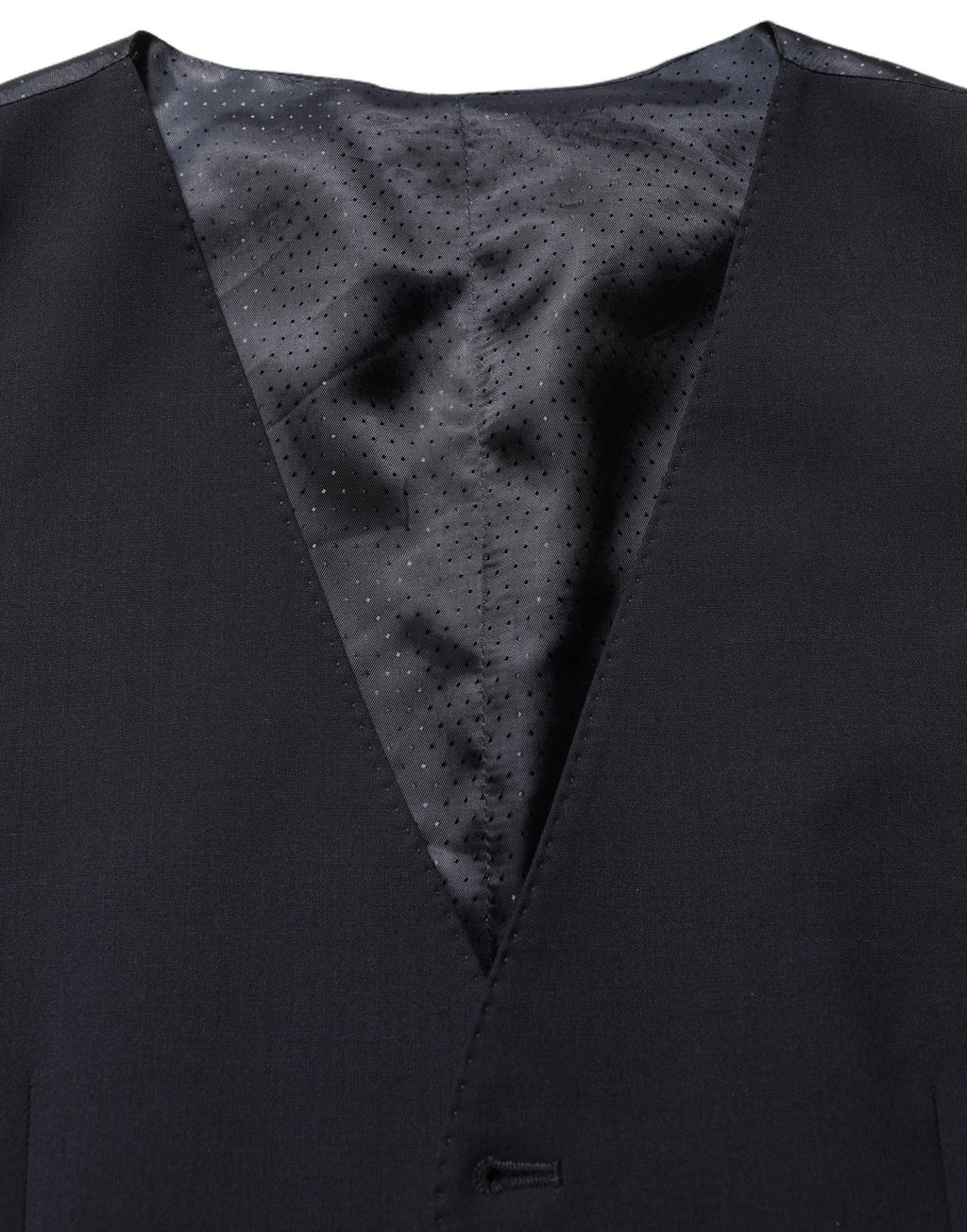 Gilet en laine noir Dolce & Gabbana à un boutonnage simple, élégant et ajusté, porté sur un fond neutre.