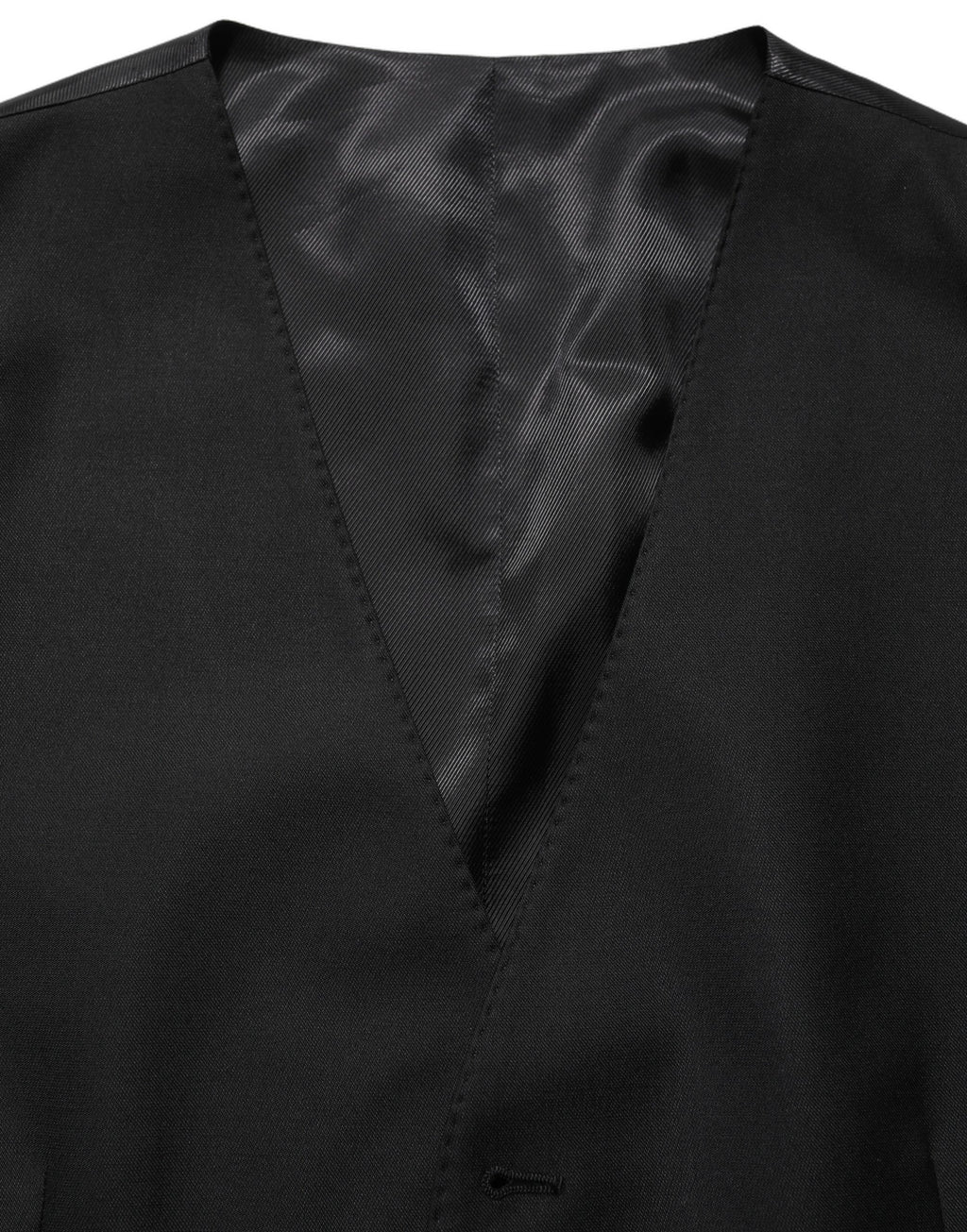 Gilet en laine noir Dolce & Gabbana à un seul boutonnage, coupe élégante et classique, porté sur un mannequin.