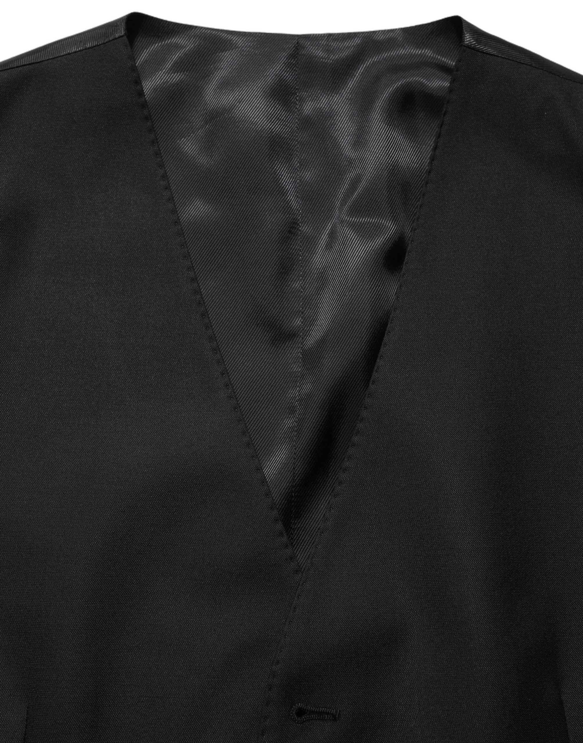 Gilet en laine noir Dolce & Gabbana à un seul boutonnage, coupe élégante et classique, porté sur un mannequin.