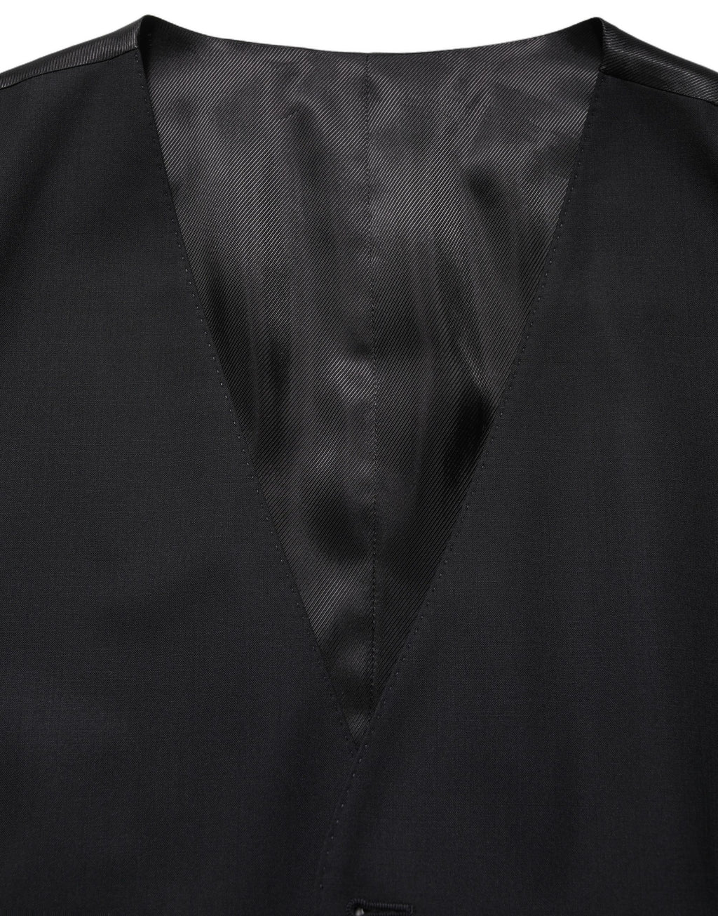 Gilet en laine noire Dolce & Gabbana à boutonnière simple, coupe ajustée et élégante, porté sur un mannequin.