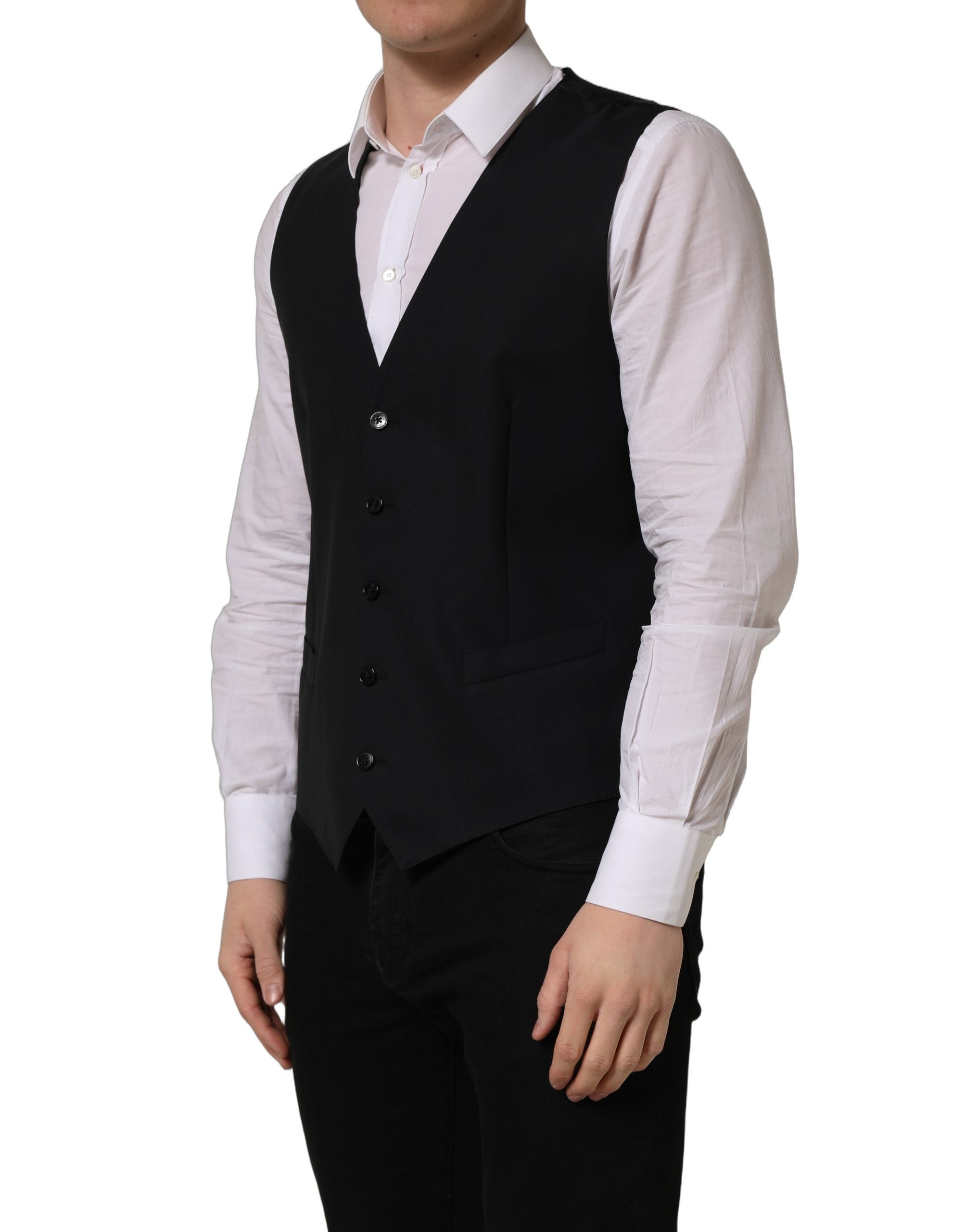 Gilet à boutonnière en laine noire de Dolce & Gabbana, coupe ajustée, porté sur mannequin, détails de couture élégants.